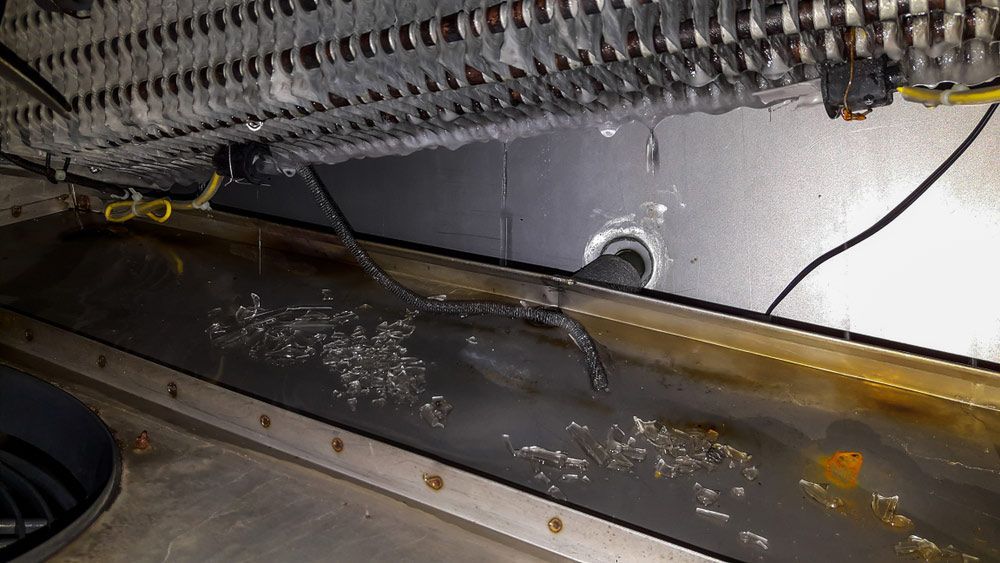 A Close Up Of The Inside Of A Refrigerator With A Hose Coming Out Of It — Macleay Air In West Kempsey, NSW