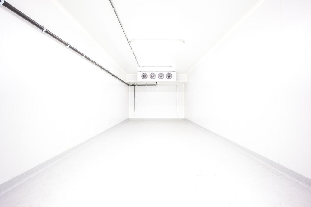 An Empty Room With White Walls And A Ceiling Fan — Macleay Air In West Kempsey, NSW