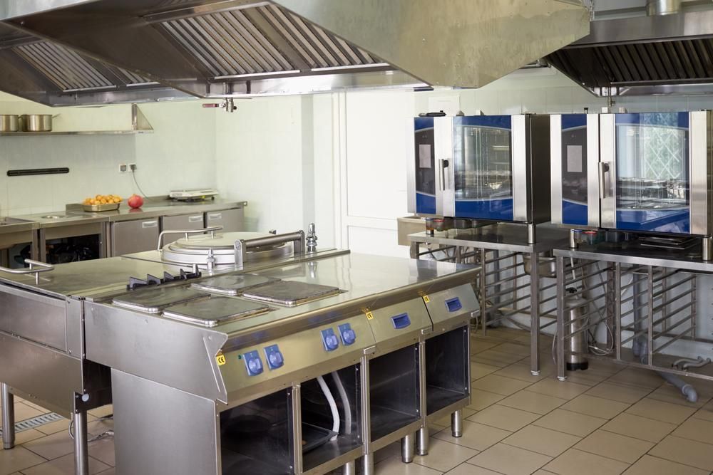 A Large Kitchen With A Lot Of Stainless Steel Appliances — Macleay Air In West Kempsey, NSW