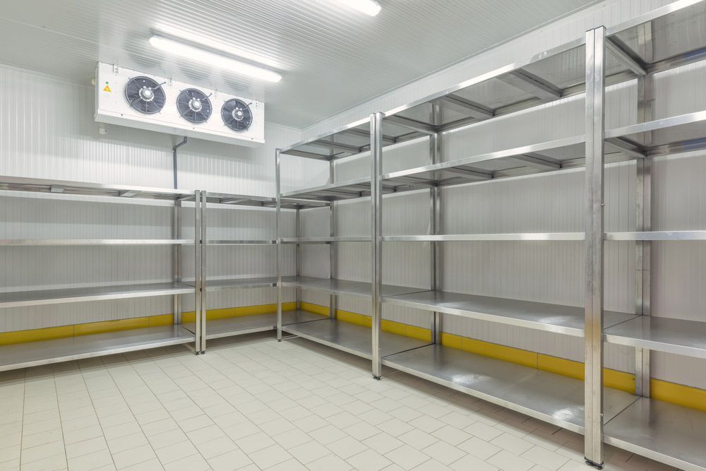 A Room With Stainless Steel Shelves And A Refrigerator — Macleay Air In West Kempsey, NSW