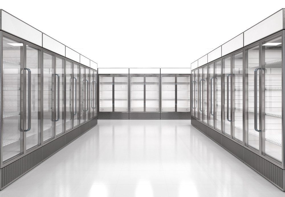 A Row Of Refrigerators With Glass Doors In A Store — Macleay Air In West Kempsey, NSW