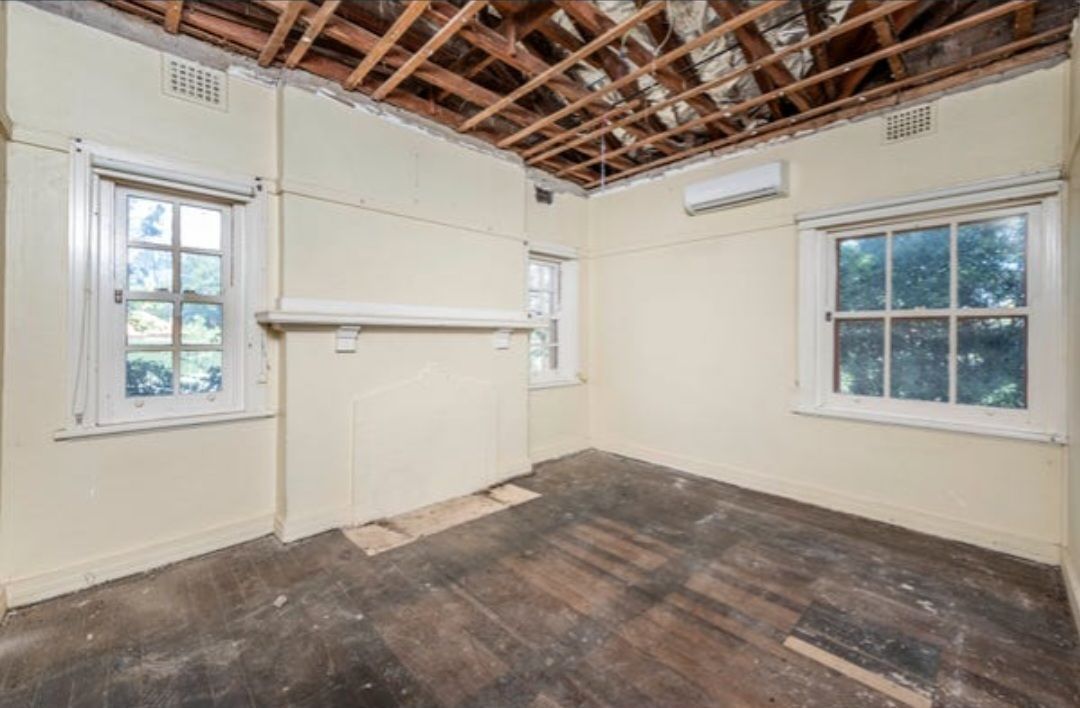 Room Interior With Exposed Ceiling Beams, Windows, Old Wood Floors, and Walls — Elimar Construction in Goulburn, NSW