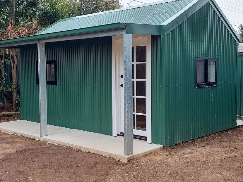 A Green Shed Next to Some Trees — Elimar Construction in Goulburn, NSW