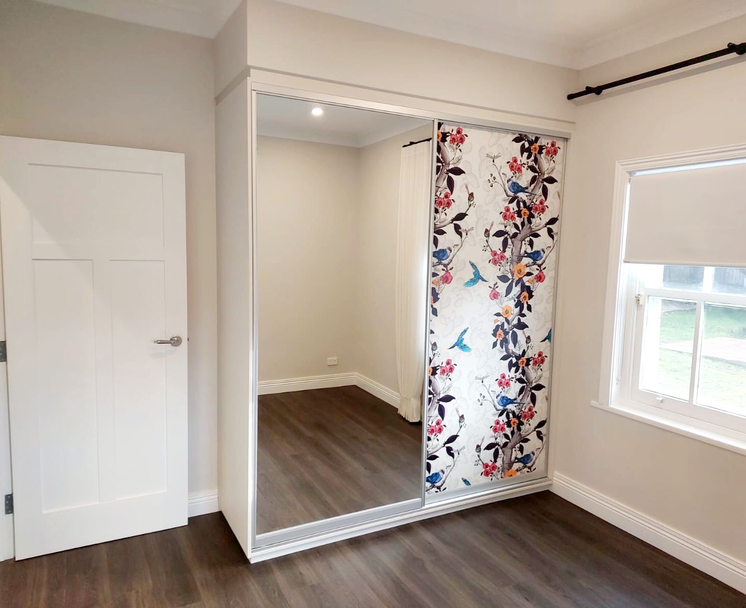 Bedroom With White Wardrobe, Patterned Sliding Door, Mirror, and a White Door to the Left — Elimar Construction in Goulburn, NSW