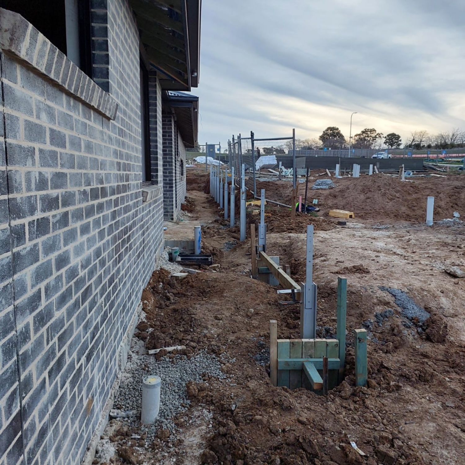 Brick Building Next to Trench — Elimar Construction in Goulburn, NSW
