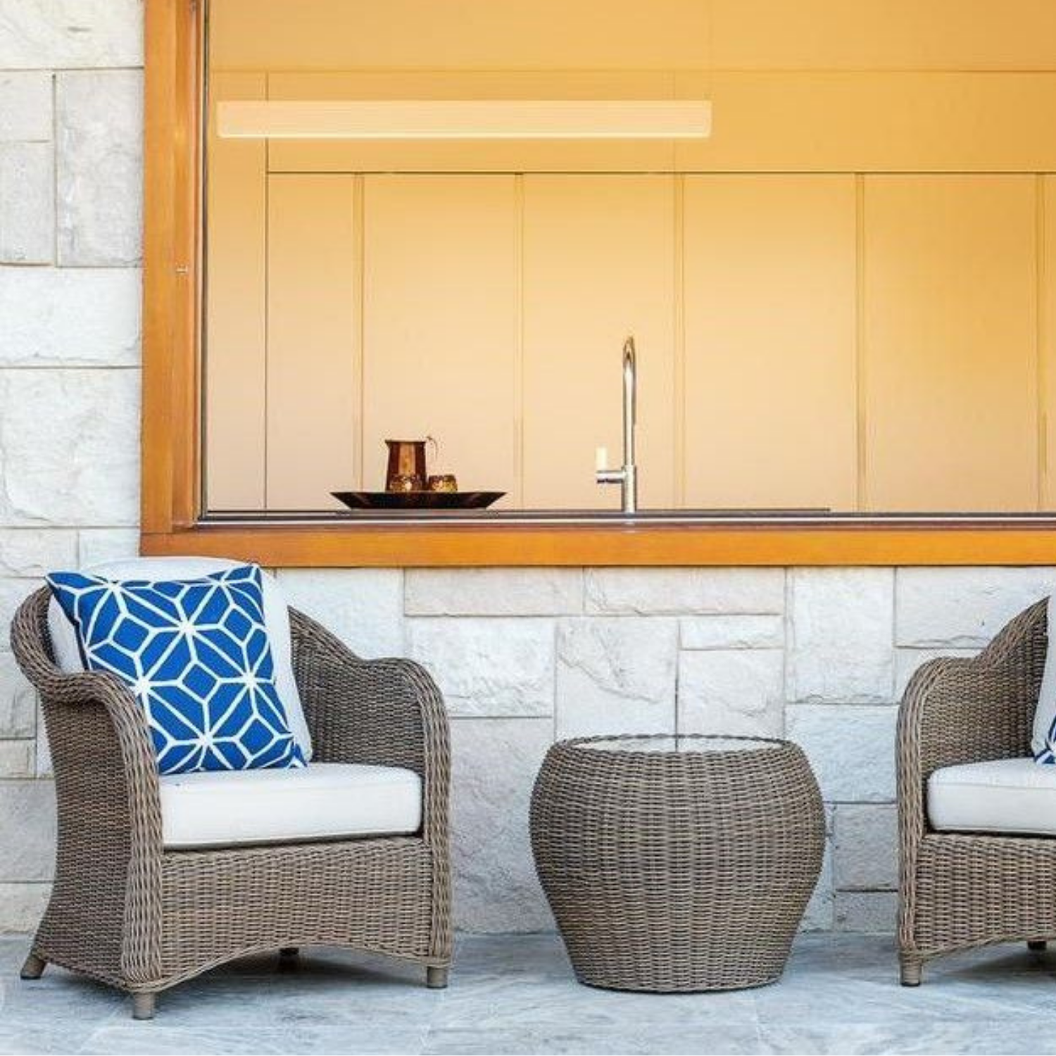 Two Wicker Chairs With Cushions and a Matching Table — Elimar Construction in Goulburn, NSW