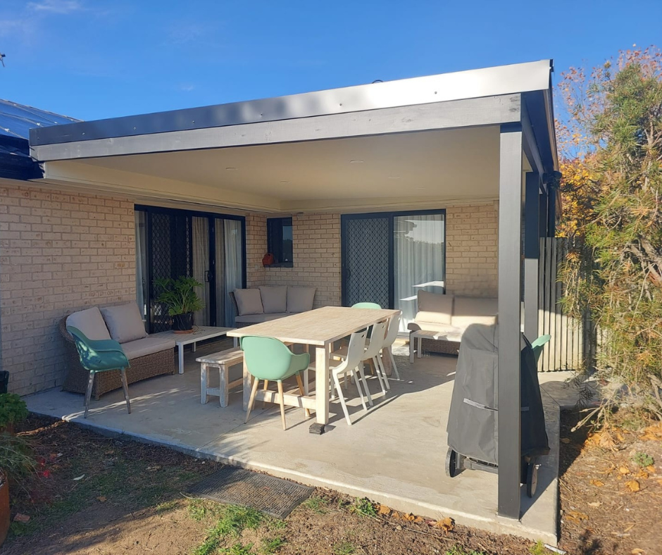 A Carport is Being Built on the Side of a House — Elimar Construction in Goulburn, NSW