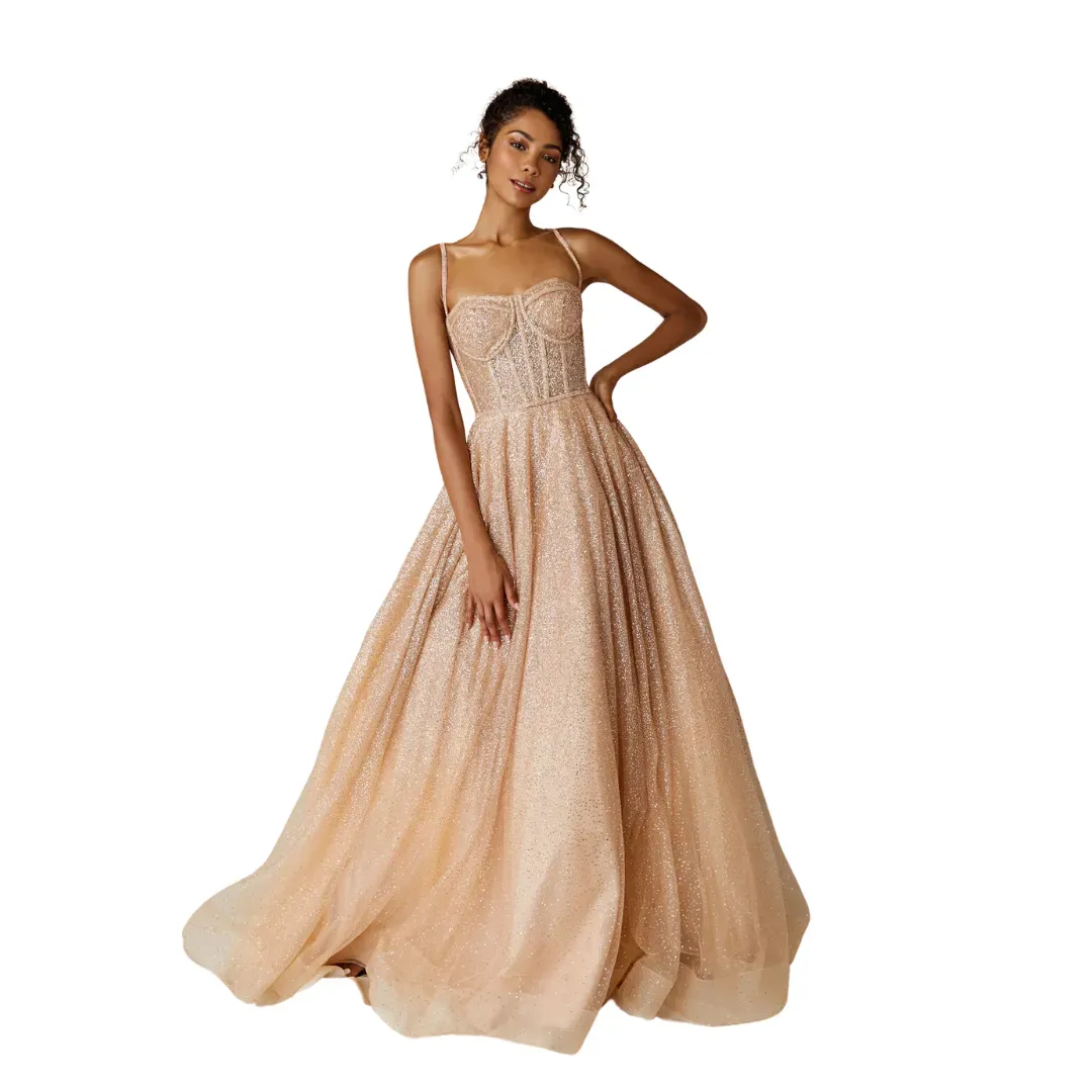Model wearing a strapless champagne ball gown with a full skirt against a white background