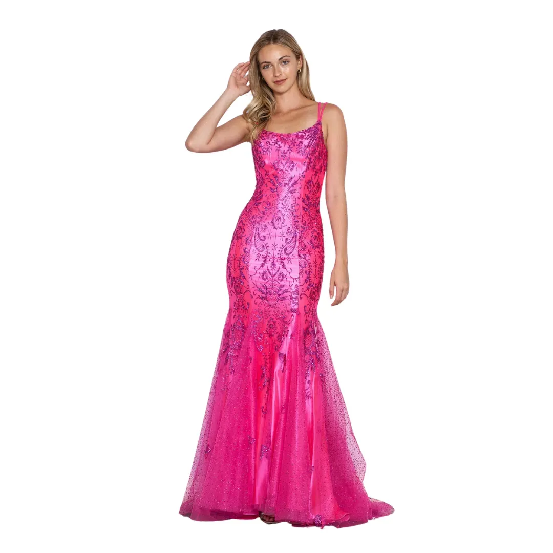 Woman in a bright pink sequined evening gown standing against a white background.