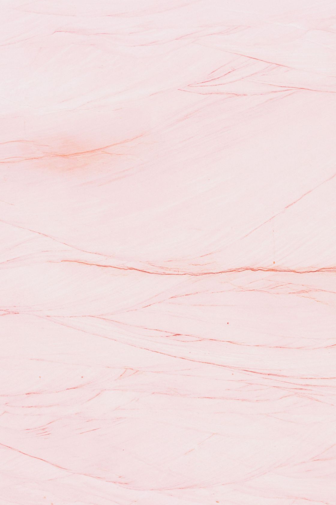 Pale pink marble texture with faint white and peach veining