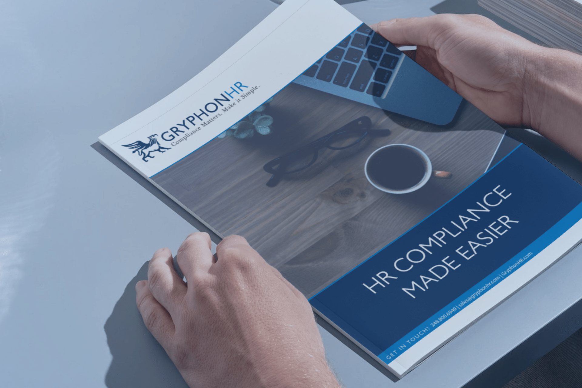 GryphonHR product brochure on desk