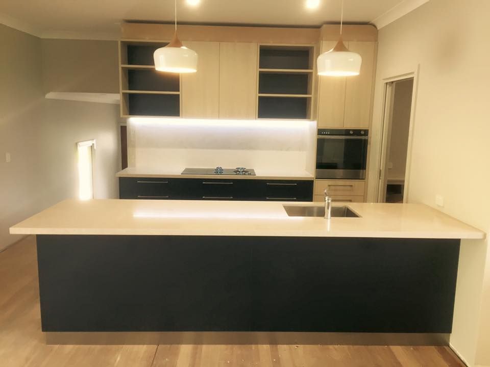 Modern Kitchen with Black Island — Platinum Kitchens & Bathrooms in North Boambee Valley, NSW