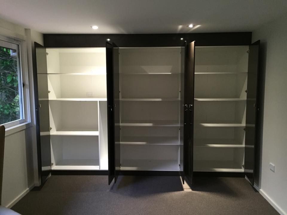Dark Cabinets with Open Doors Revealing White Shelves — Platinum Kitchens & Bathrooms in North Boambee Valley, NSW