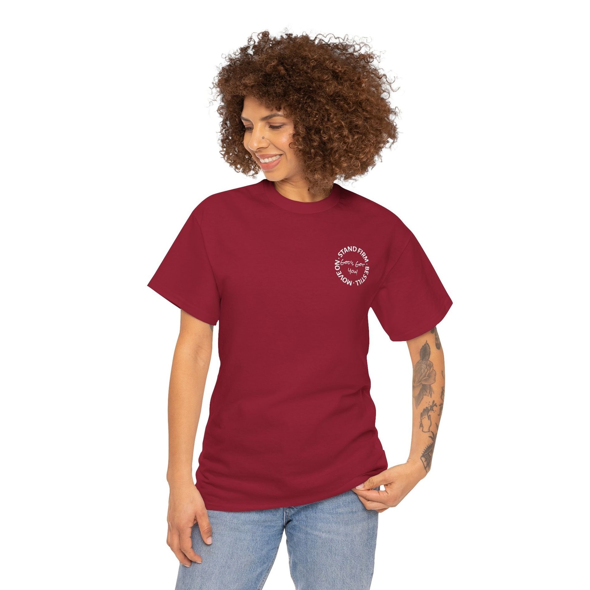 Woman in a maroon t-shirt with a small logo on the chest, smiling.