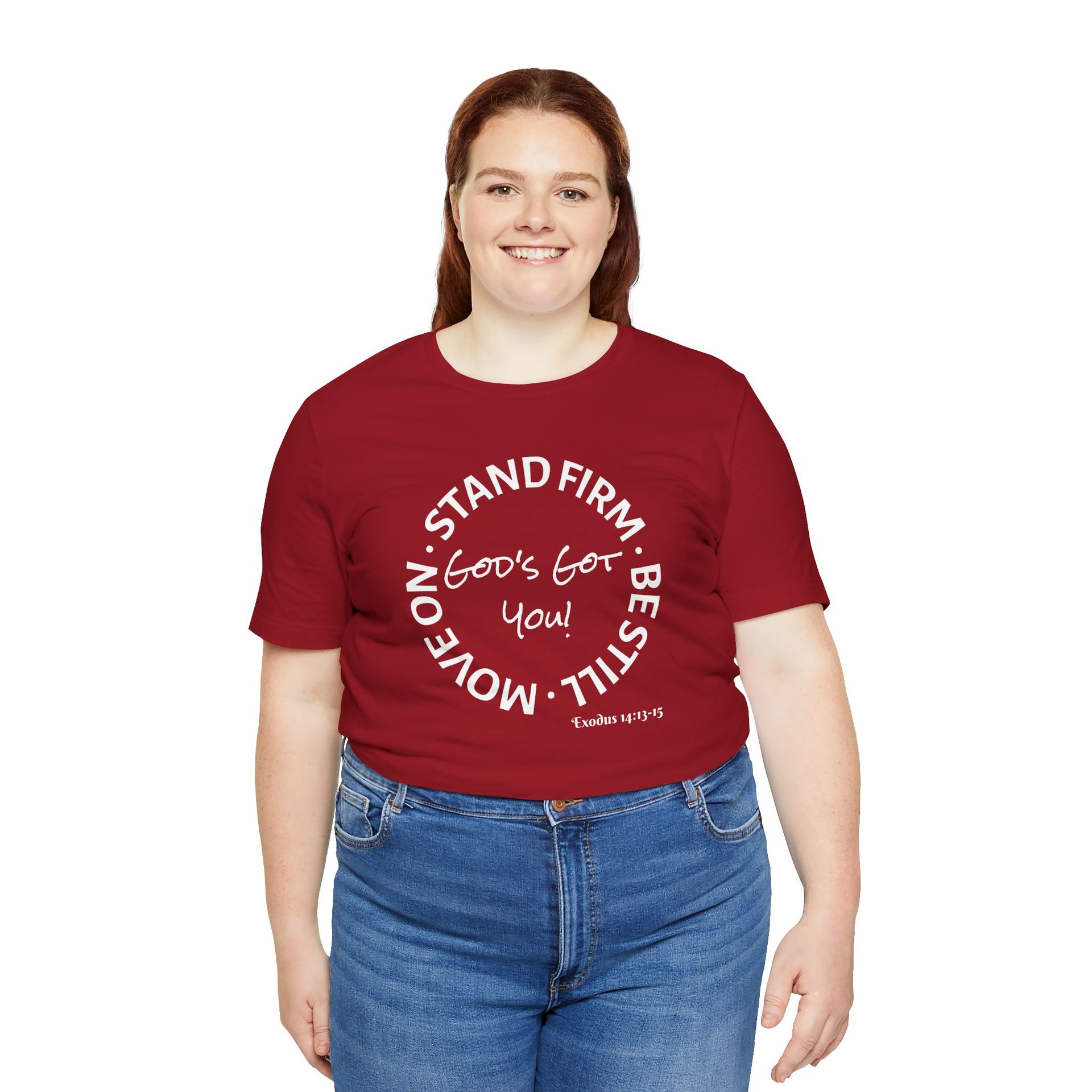 Woman wearing a red t-shirt with a white circular design and the words "Stand Firm, Be Still, Move On. God's Got You!"