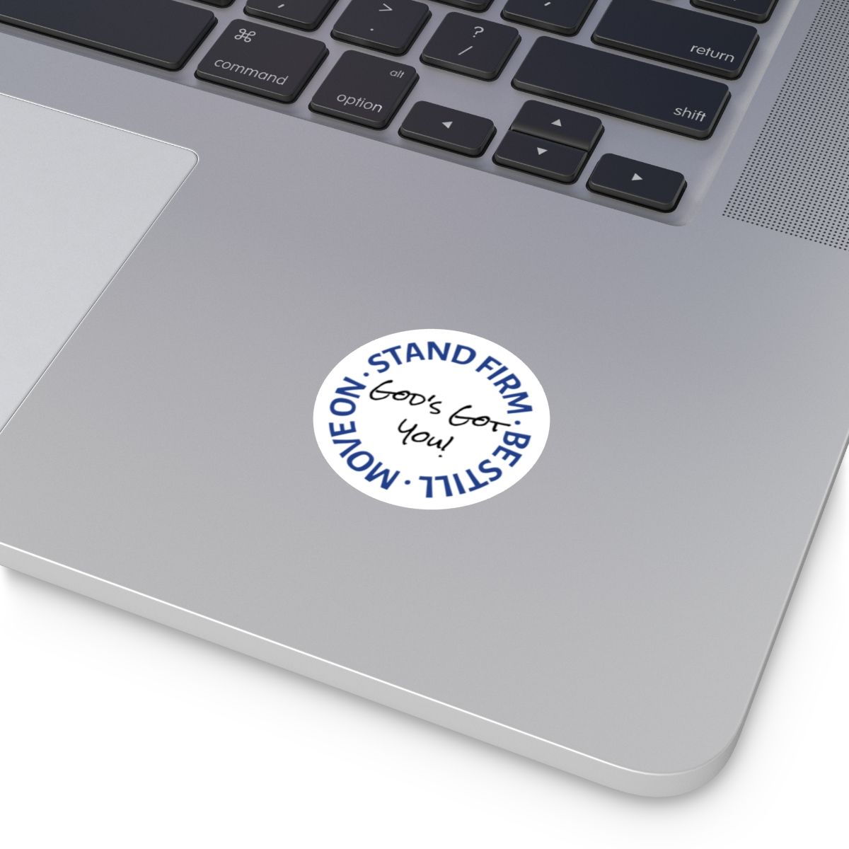 White sticker on a laptop with the words 
