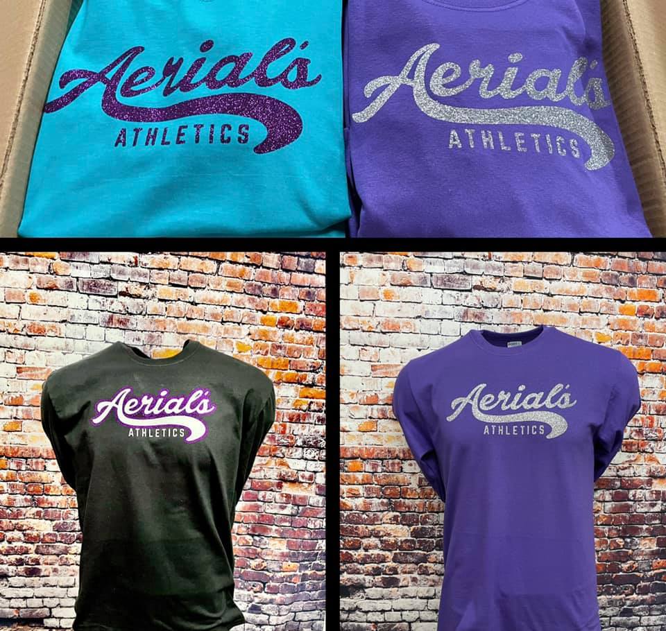 Aerial's Athletics apparel in blue, purple, and black with glittery branding, shown folded and on display mannequins.