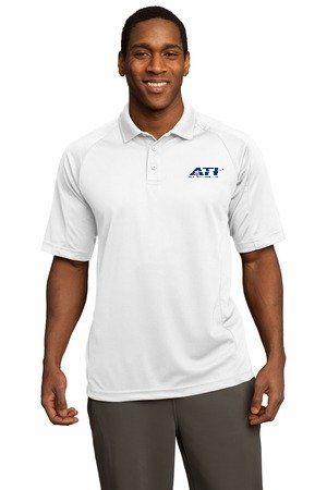 A person smiling while wearing a white collared polo shirt featuring a small blue logo on the left chest.