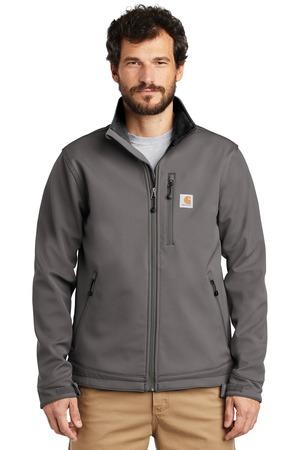 A man wearing a grey Carhartt soft-shell jacket with a high collar, zipper closure, and chest pocket, over a grey shirt.