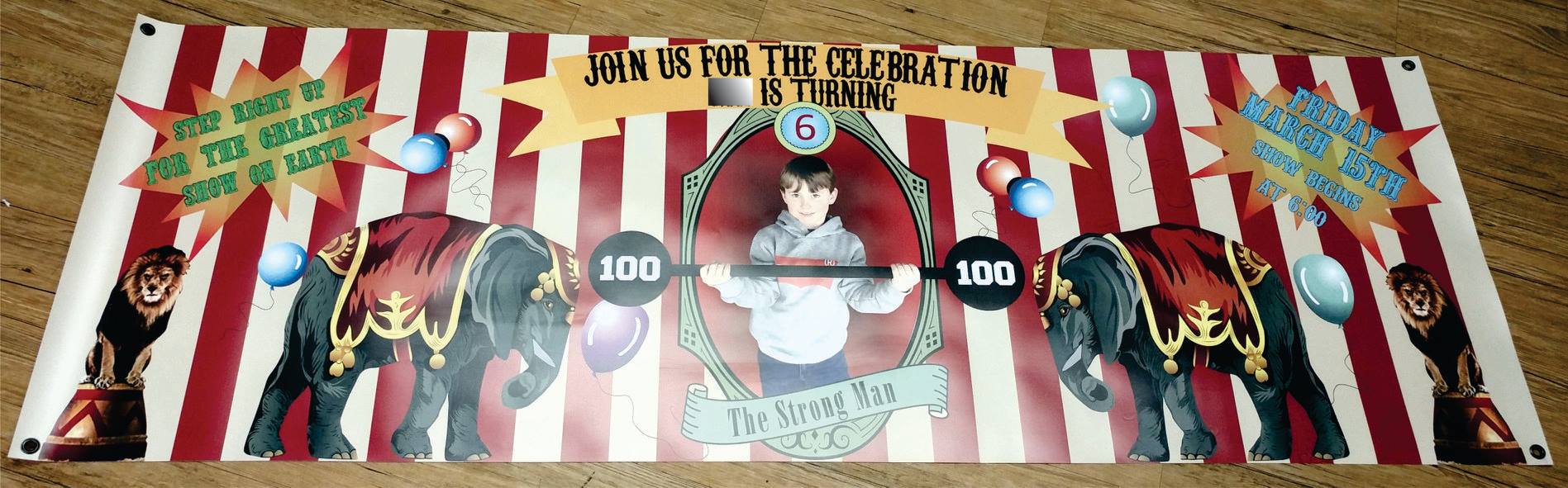 A circus-themed banner with red and white stripes, two elephants, and a central portrait frame for a birthday celebration.