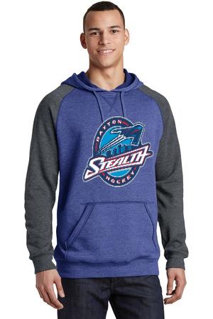 A person wearing a blue and grey color-blocked hooded sweatshirt with a