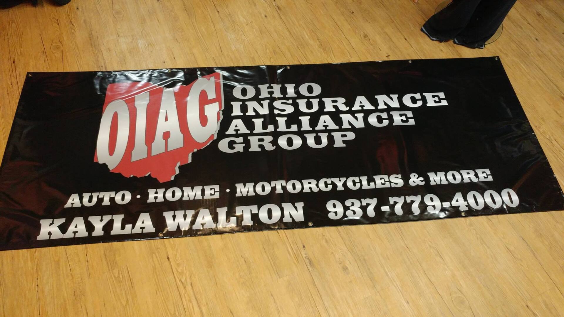 Black banner for Ohio Insurance Alliance Group featuring the name, services, phone number, and Kayla Walton.
