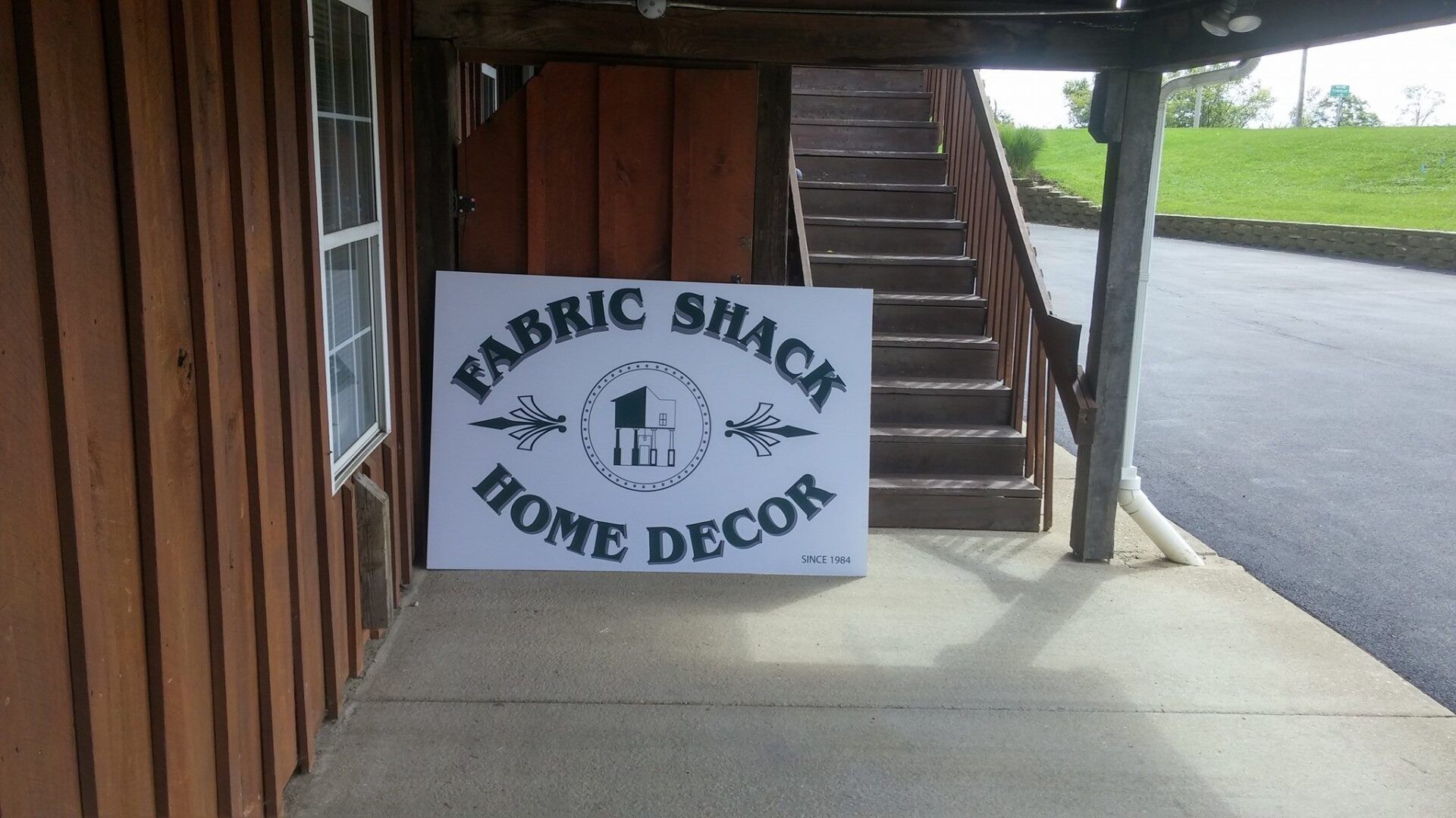 A white sign that reads