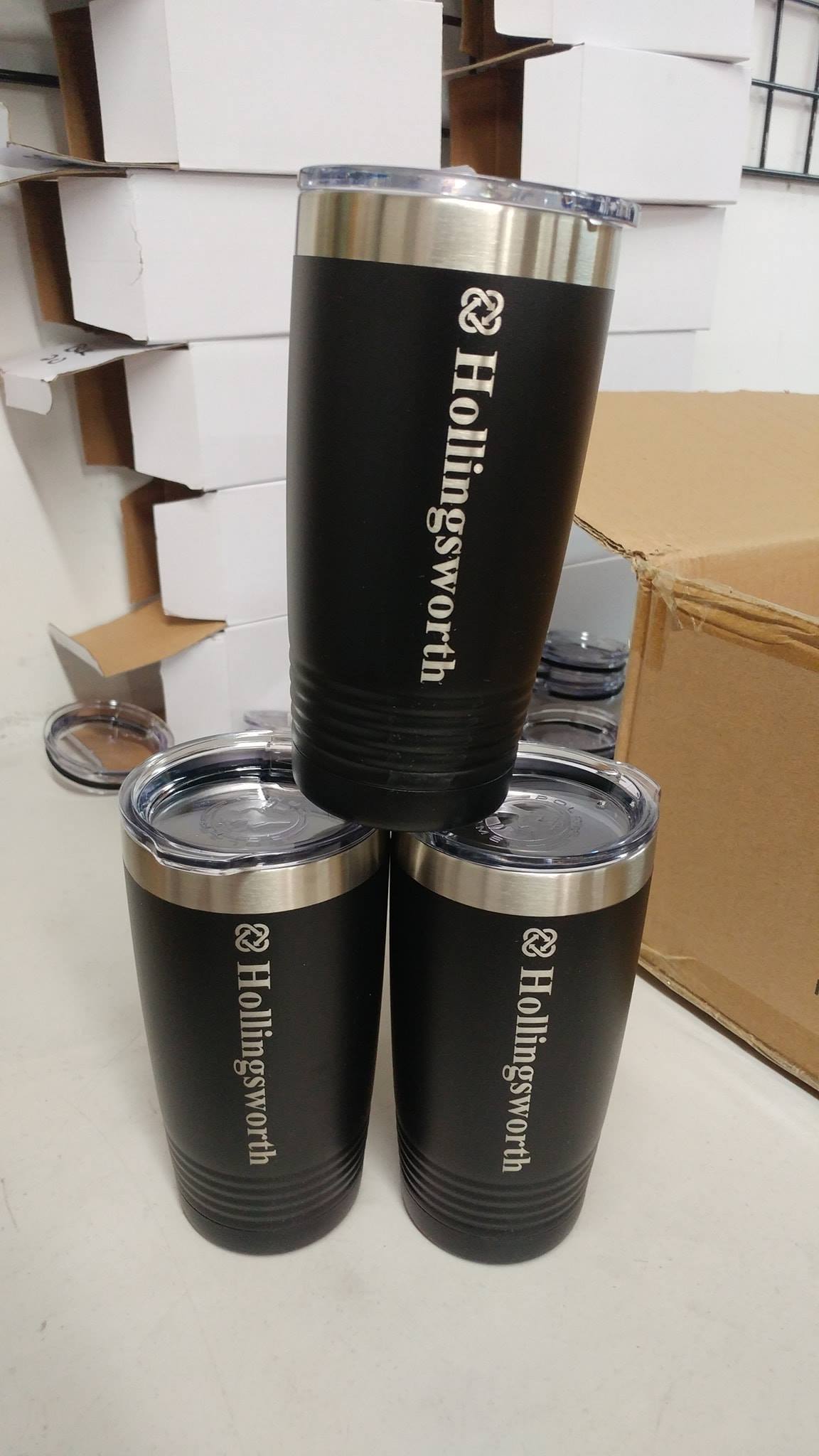 Three black insulated tumblers with lids, engraved with the name