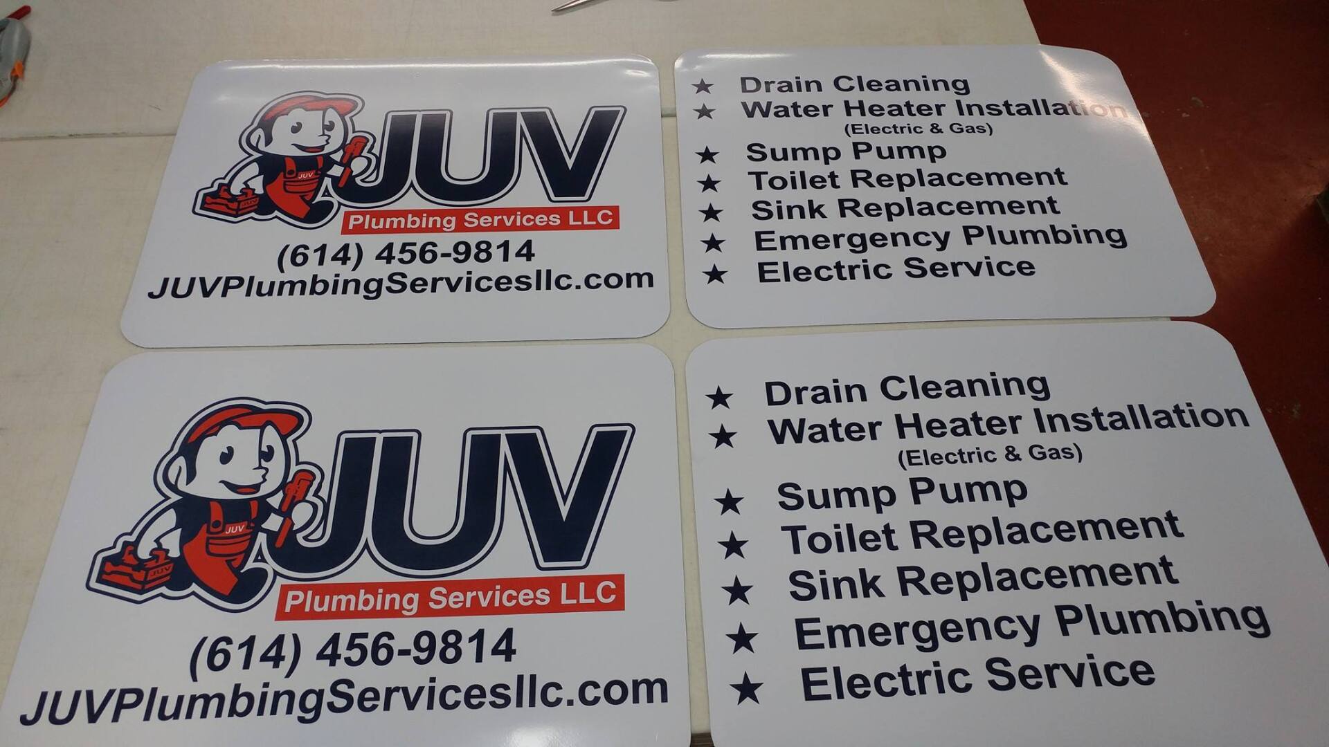 Two identical sets of stickers showing the JUV Plumbing Services LLC logo, phone number, website, and list of services.