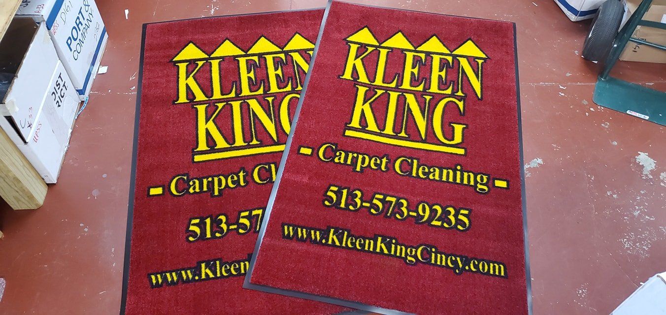 Two red floor mats featuring the