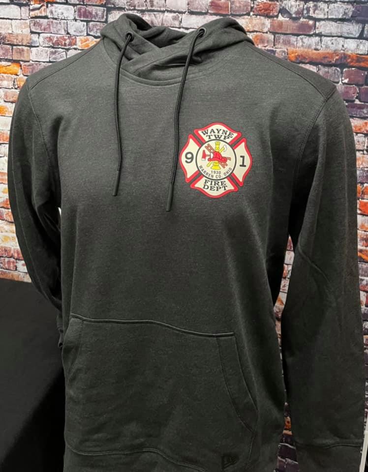 A dark gray hooded sweatshirt featuring a red and gold Sayre Fire Dept logo on the left chest against a brick wall.