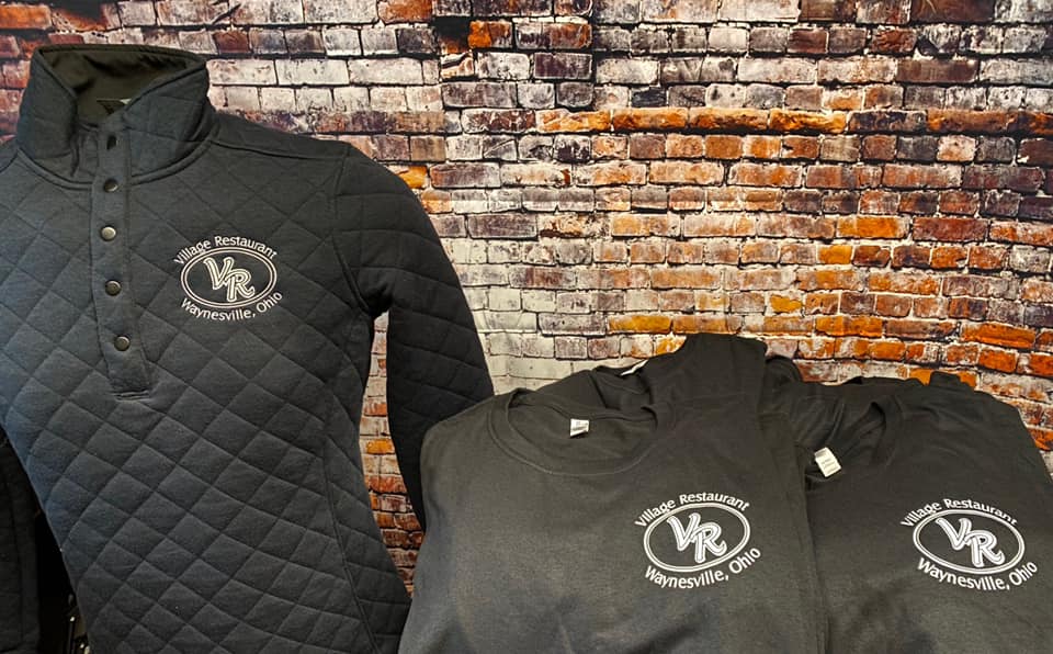 A dark gray quilted pullover and two matching t-shirts, all featuring a
