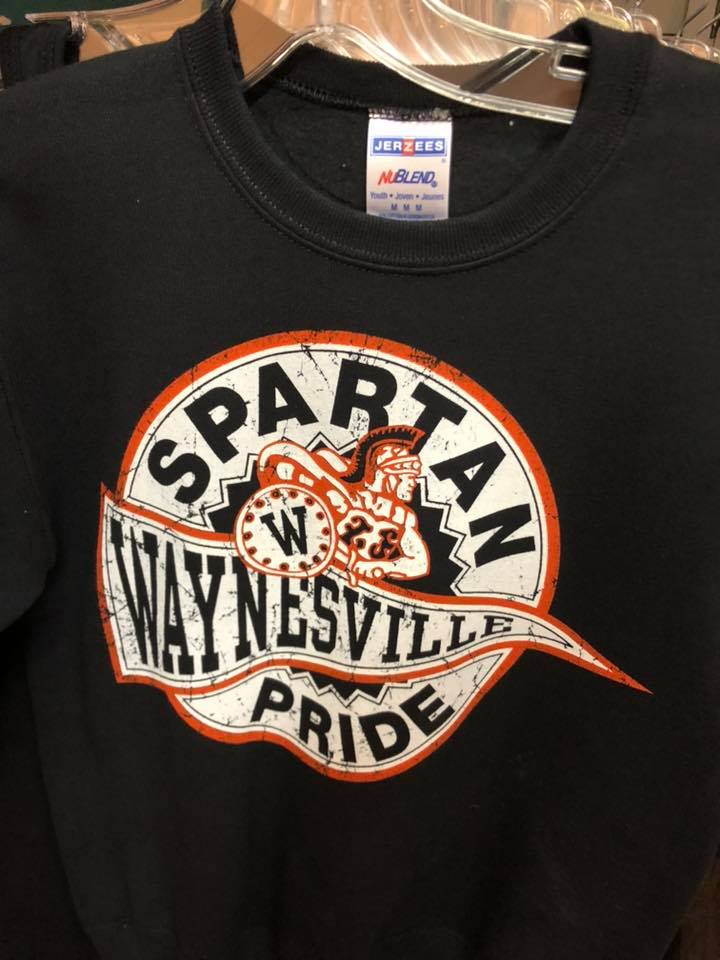 A black t-shirt featuring a circular orange and white