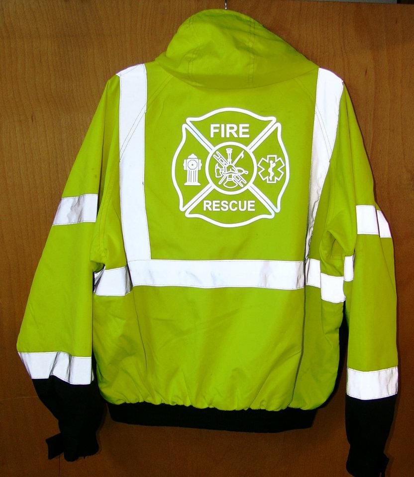 A bright yellow high-visibility Fire Rescue jacket with white reflective stripes and a central Fire Rescue emblem.