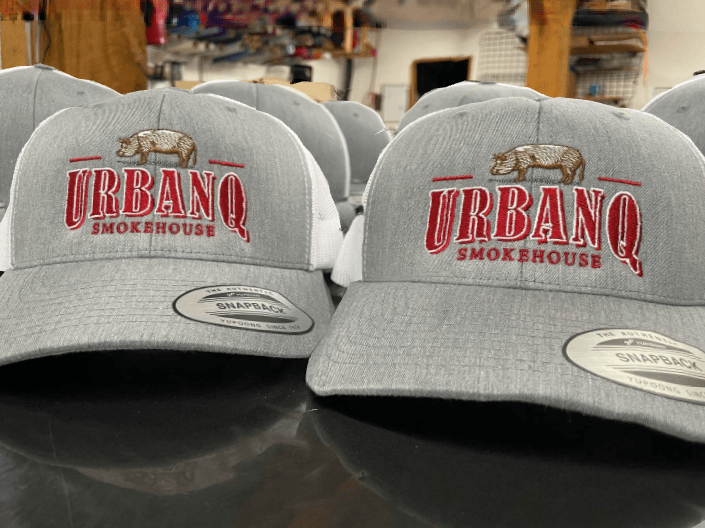 Gray and white snapback hats featuring the 