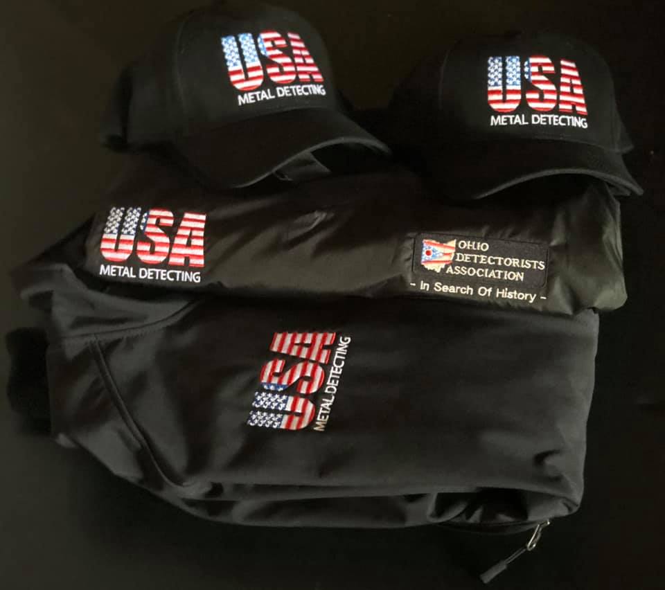 Two black hats and a black jacket featuring