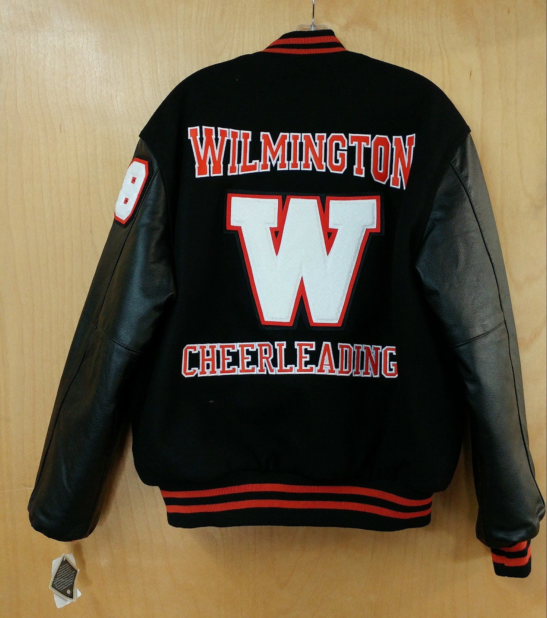Black varsity jacket with leather sleeves, featuring 