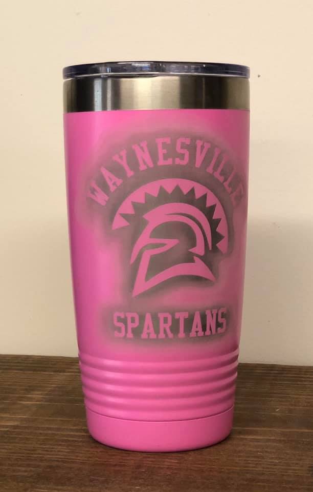 A pink, insulated stainless steel tumbler with the