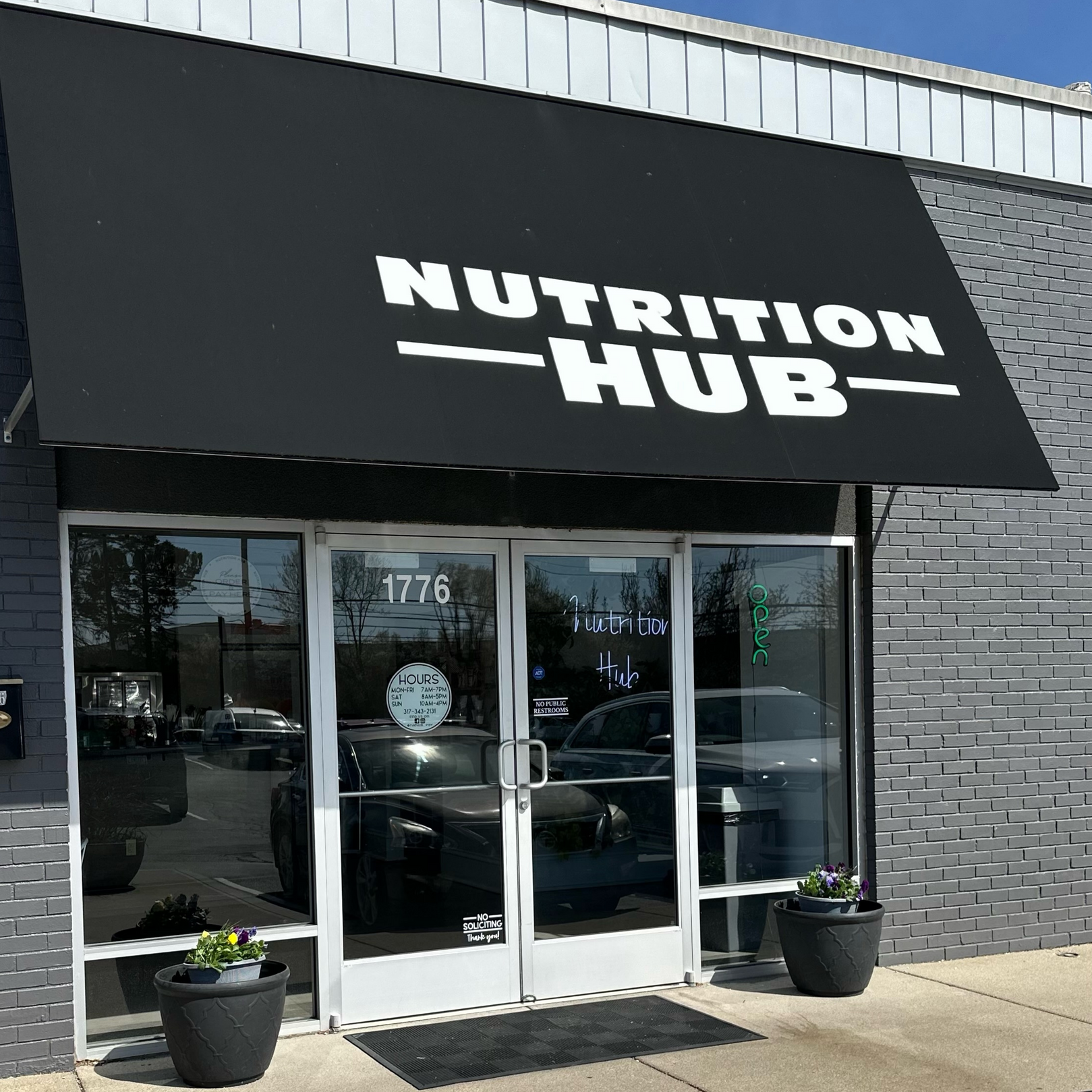 A building with a black awning that says nutrition hub
