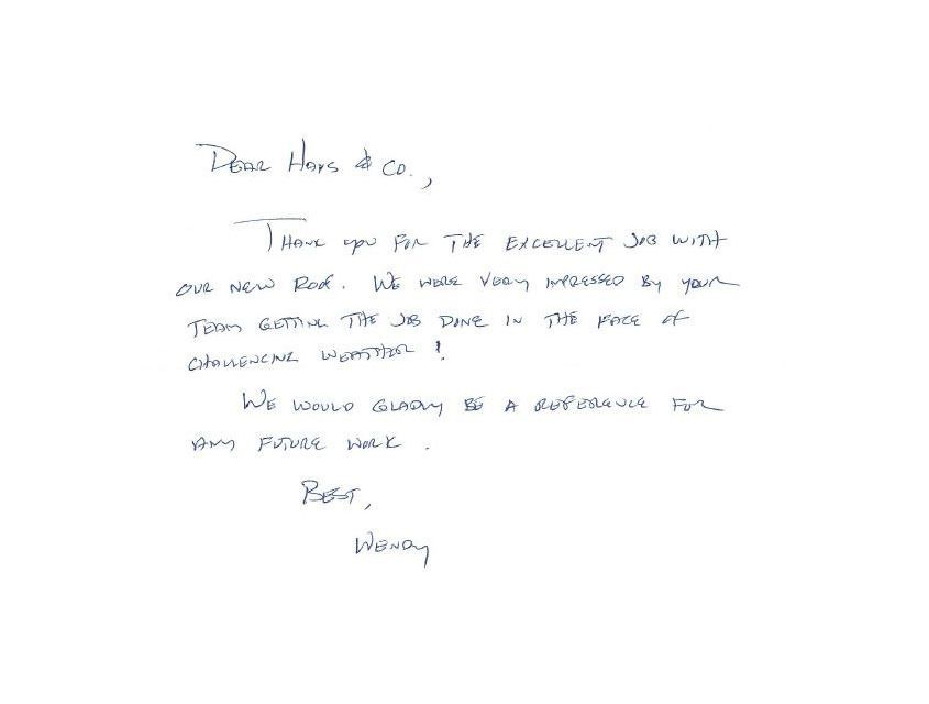 Handwritten thank-you note on white paper. Text expresses gratitude for service with a new roof. Signed 