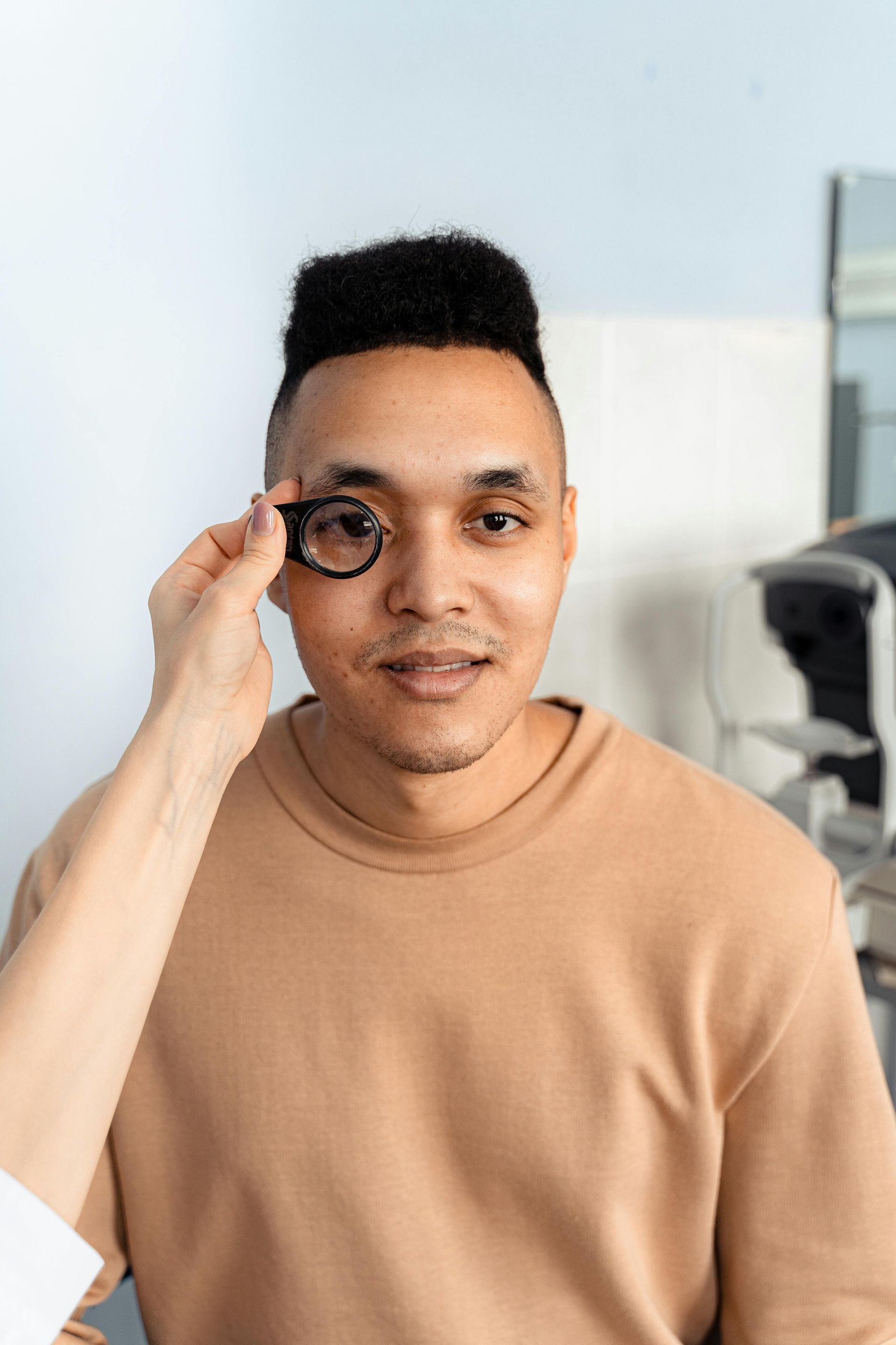 A man is getting his eyes examined by an ophthalmologist.