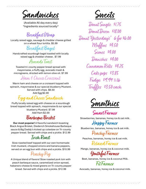 Handwritten café menu with sandwiches, sweets, and smoothies in black, pink, and teal text.