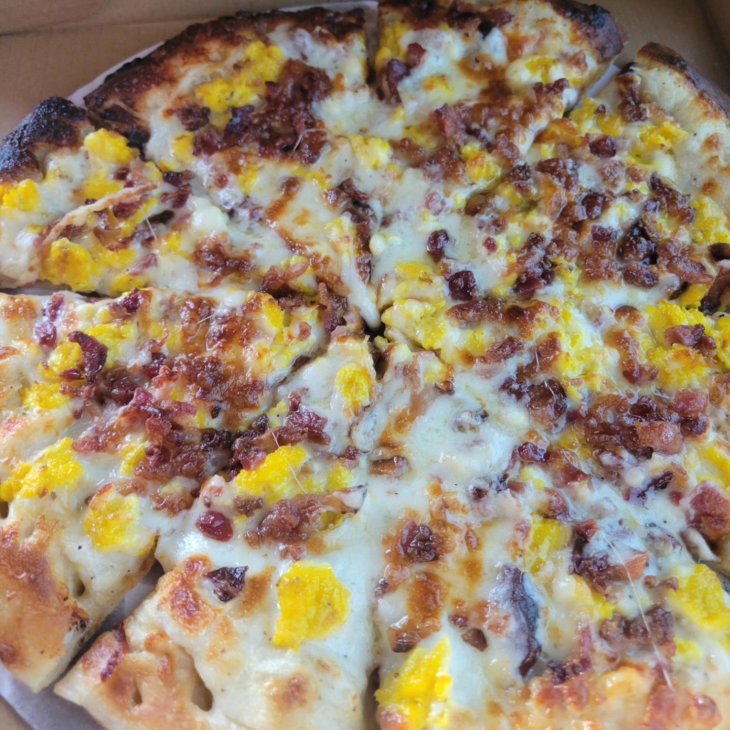 Cheese and pepperoni pizza with browned crust on a tray