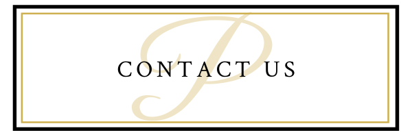 Contact us text on a white button with a gold decorative swirl border.
