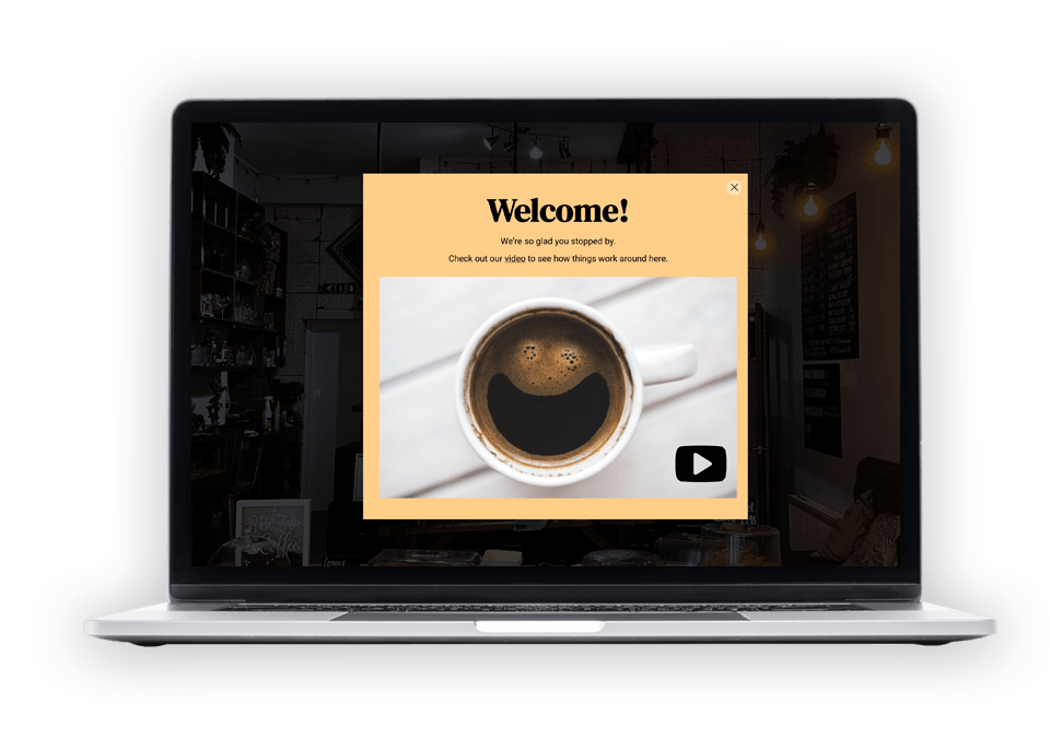 A laptop with a picture of a cup of coffee on the screen.