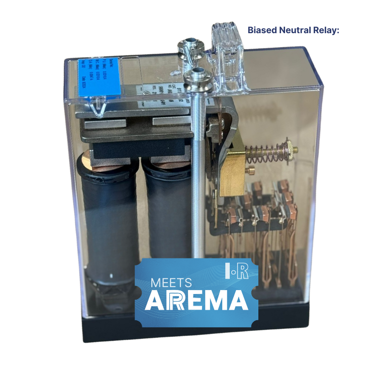 A Biased Neutral Relay in a clear plastic housing, featuring internal coils and an AREMA compliance sticker.