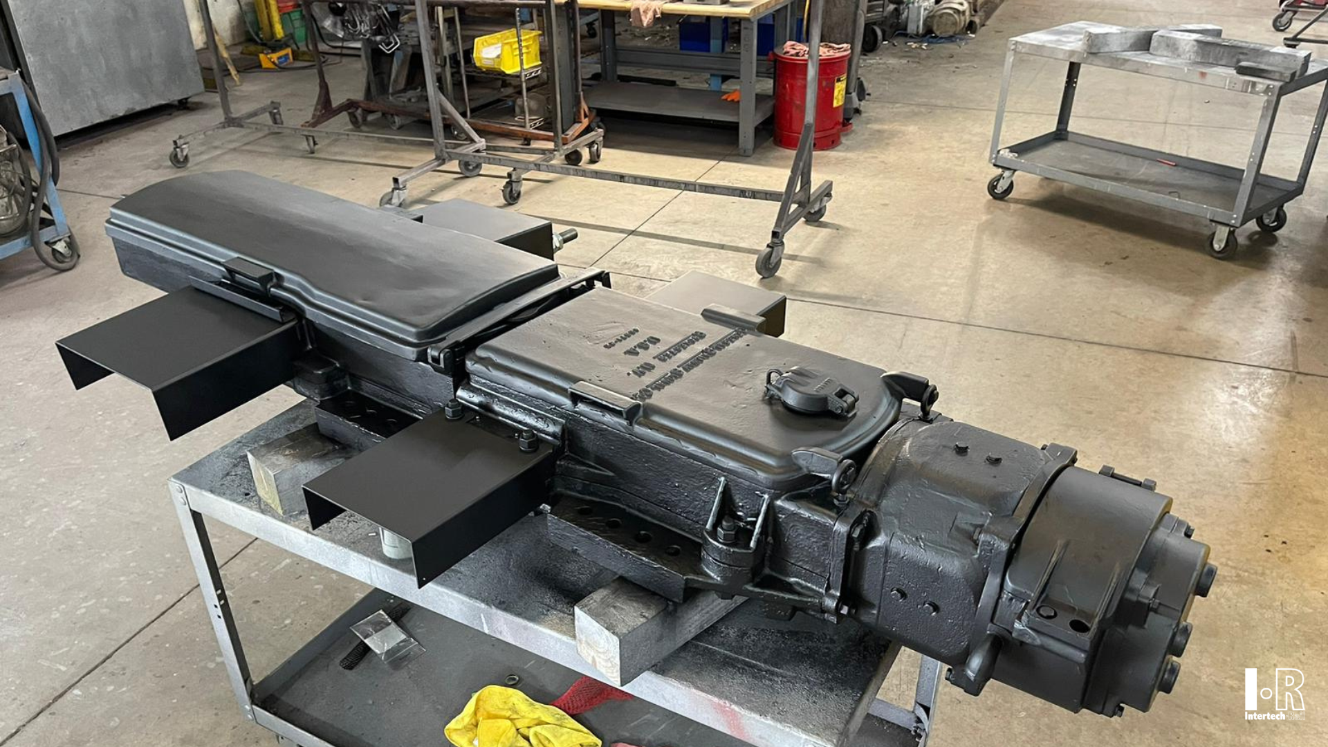 IR5G switch machine by Intertech Rail on a metal cart in a workshop setting