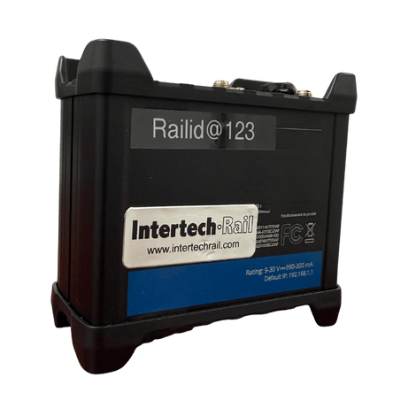 Black Railid@123 device by Intertech-Rail. Rectangular with blue accents, sitting on small black feet.