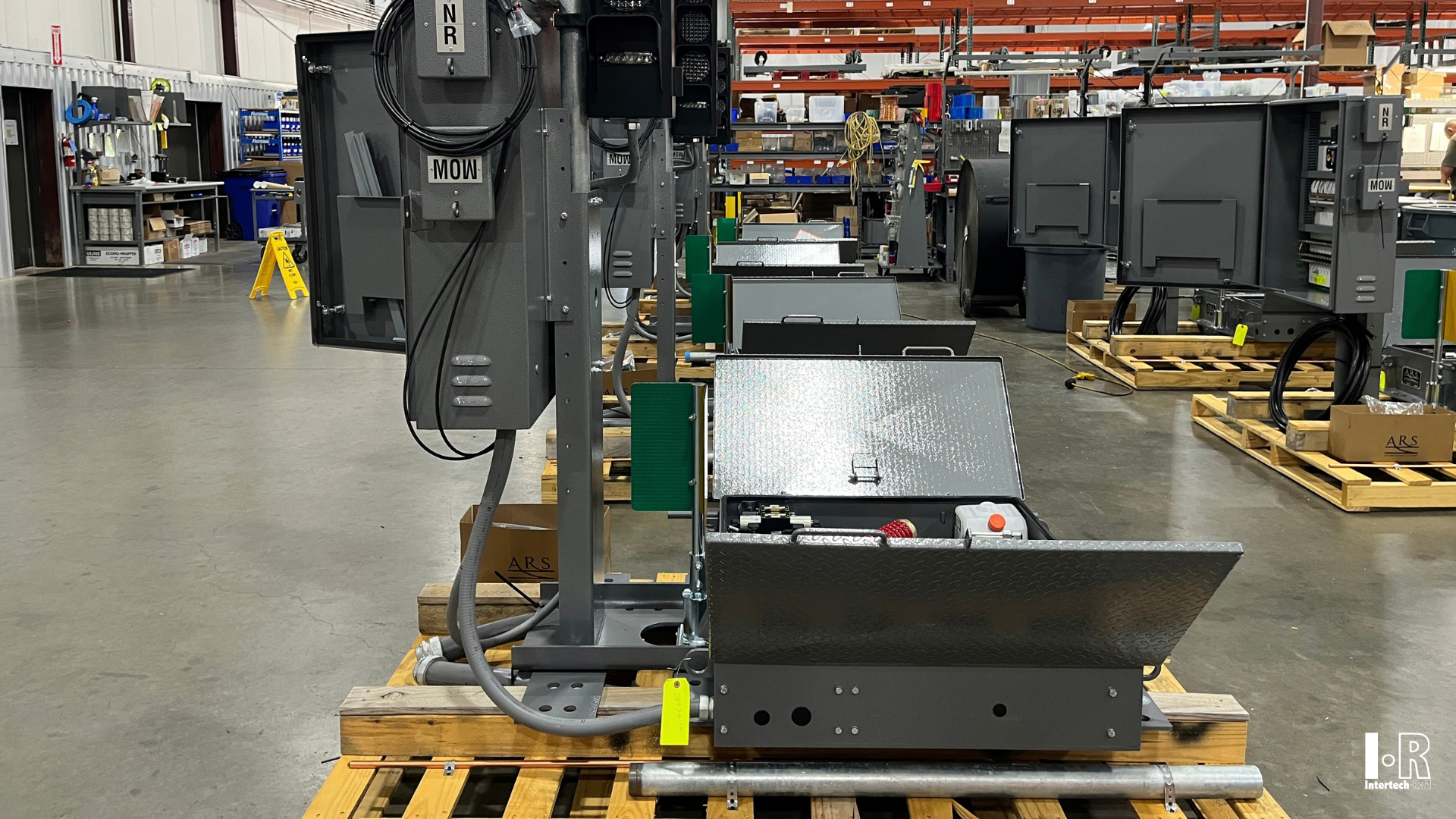 IRYM-16 hydraulic switch machine by Intertech Rail on a pallet in a warehouse,