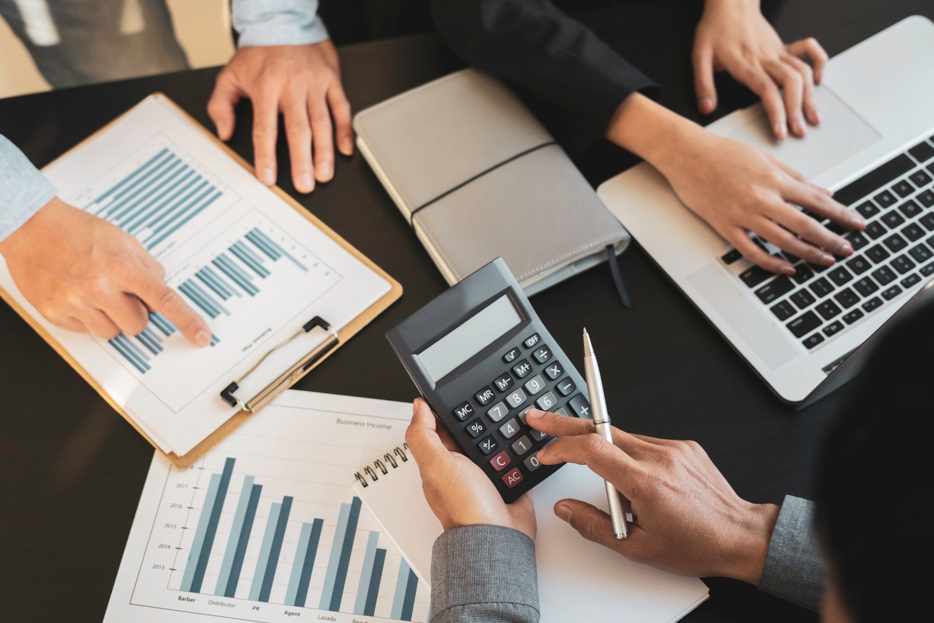 Group of businesspeople busies discussing financial Business people brainstorming at office desk